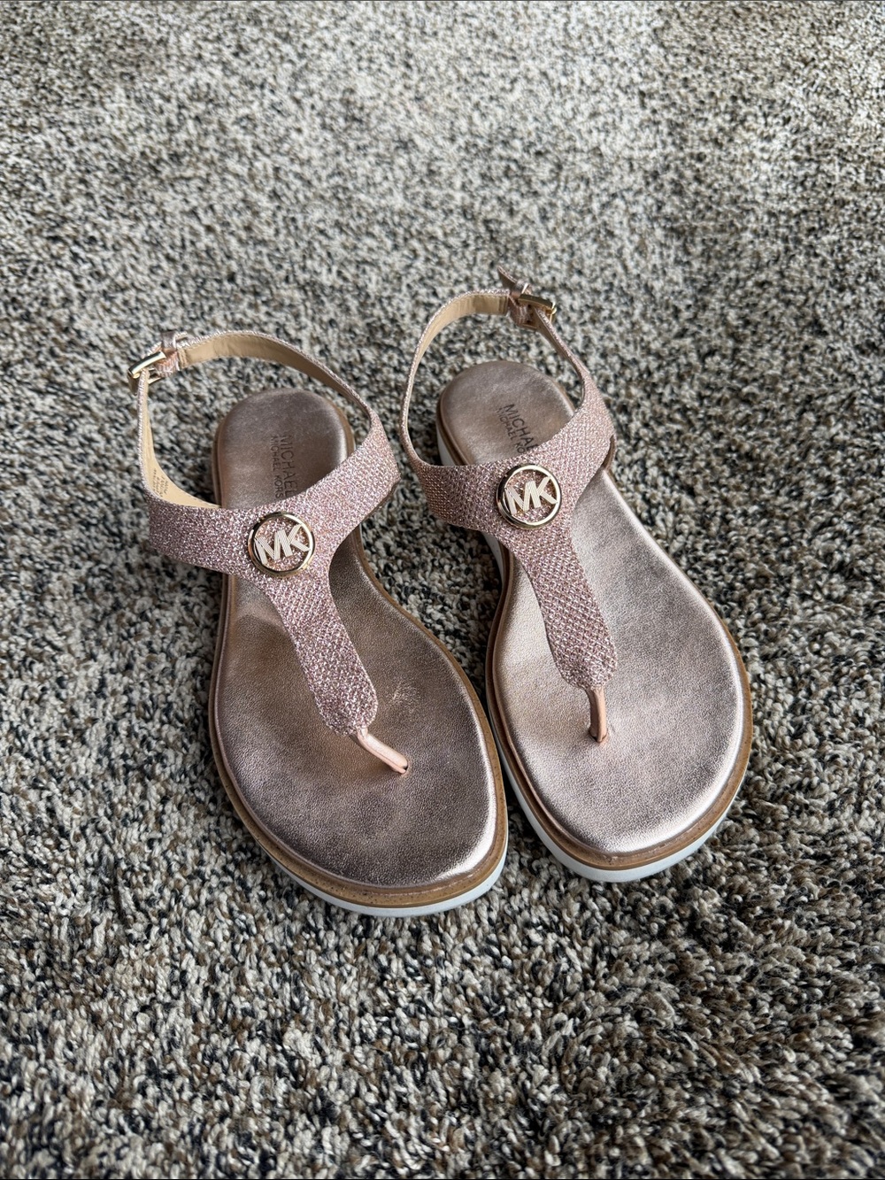 Michael Kors Metallic Rose Gold T-Strap Sandals with MK Medallion